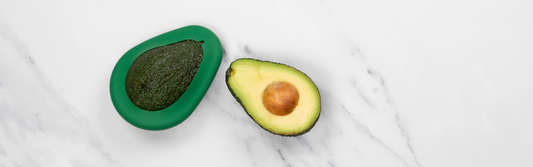 An easy way to keep avocados fresh using reusable Avocado Huggers from women-owned, B Corp certified company, Food Huggers. Help reduce food waste with this simple sustainable swap.