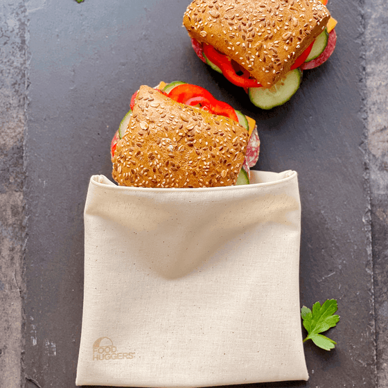 A reusable Food Huggers Fabric Bag preserving two sandwiches