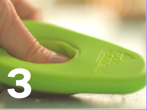 Step three, finger the knob pressing down on the hole of the Avocado Hugger.