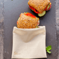 A reusable Food Huggers Fabric Bag preserving two sandwiches