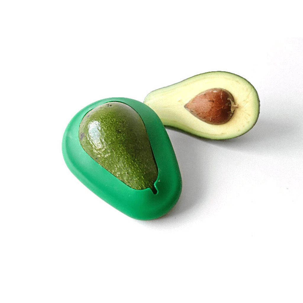 A silicone Eco friendly Food Hugger preserving half an avocado next to it the other unprotected half of the avocado