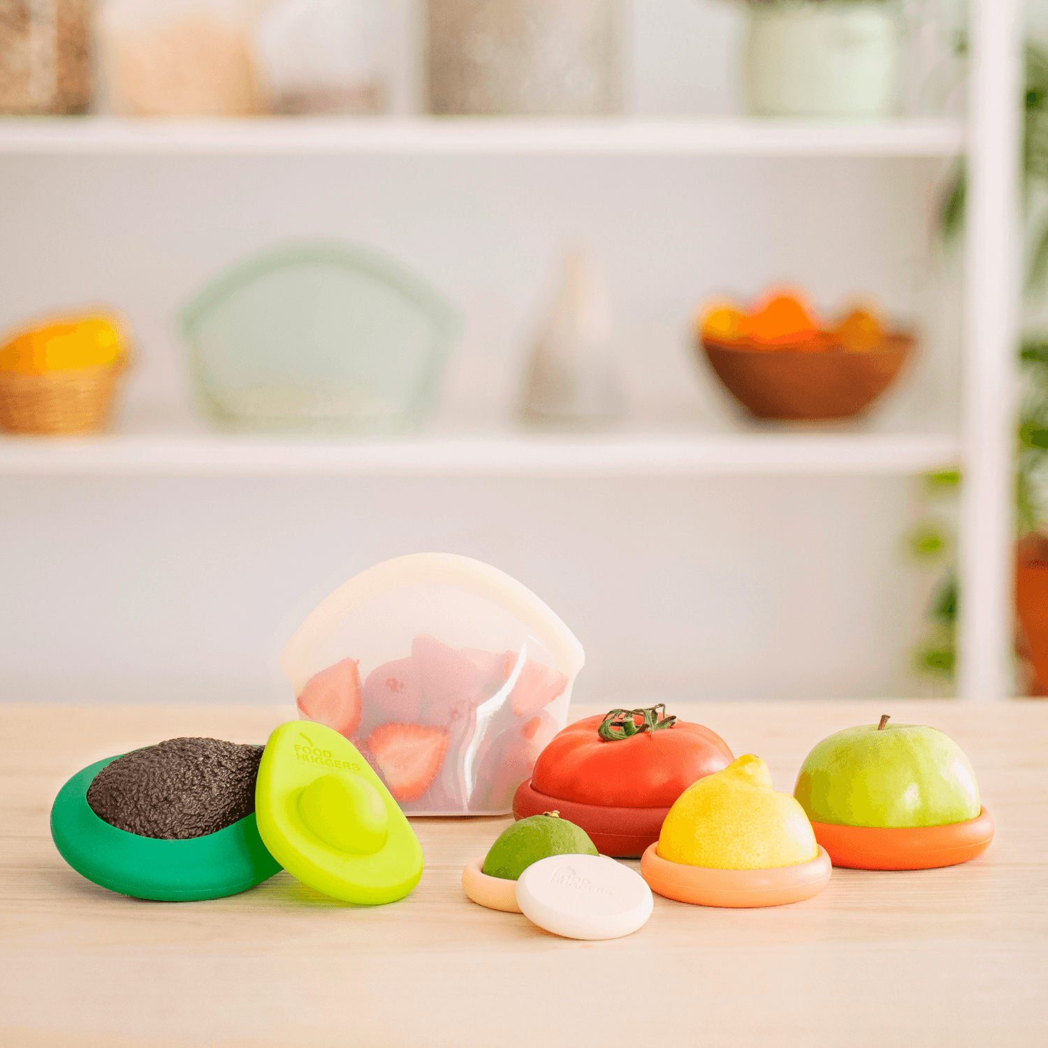 Set of eight orange silicone Food Huggers a sustainable alternative to plastic wrap to protect food on a wooden table