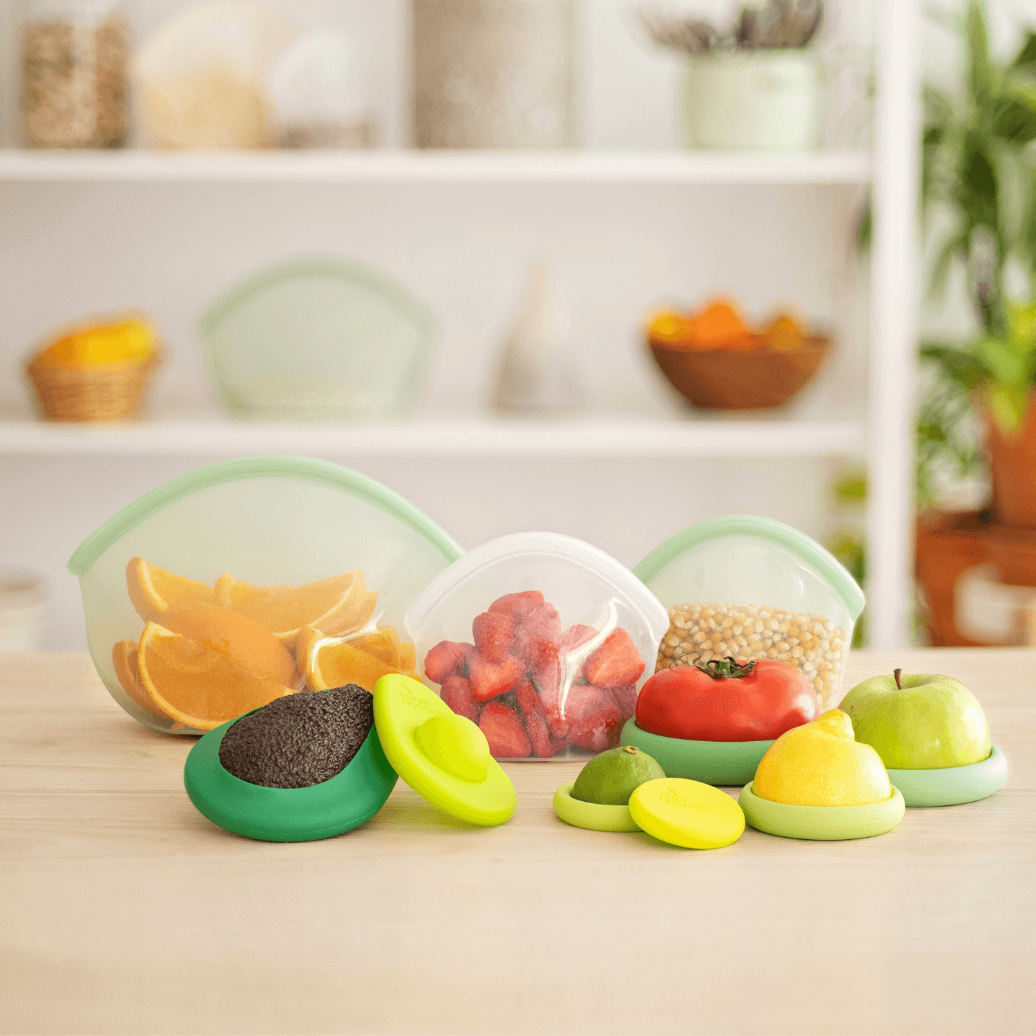 Set of ten silicone Food Huggers protecting fruits and vegetables on a wooden table, sustainable alternative to plastic wrap