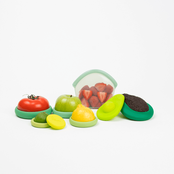 Set of eight green silicone Food Huggers, a sustainable alternative to plastic wrap, to protect fruits and vegetables