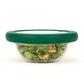 Glass bowl with green hugger lid preserving spinach, the perfect alternative for zero waste
